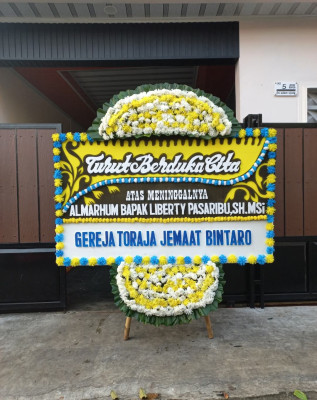 Papan Bunga Duka di Dokome